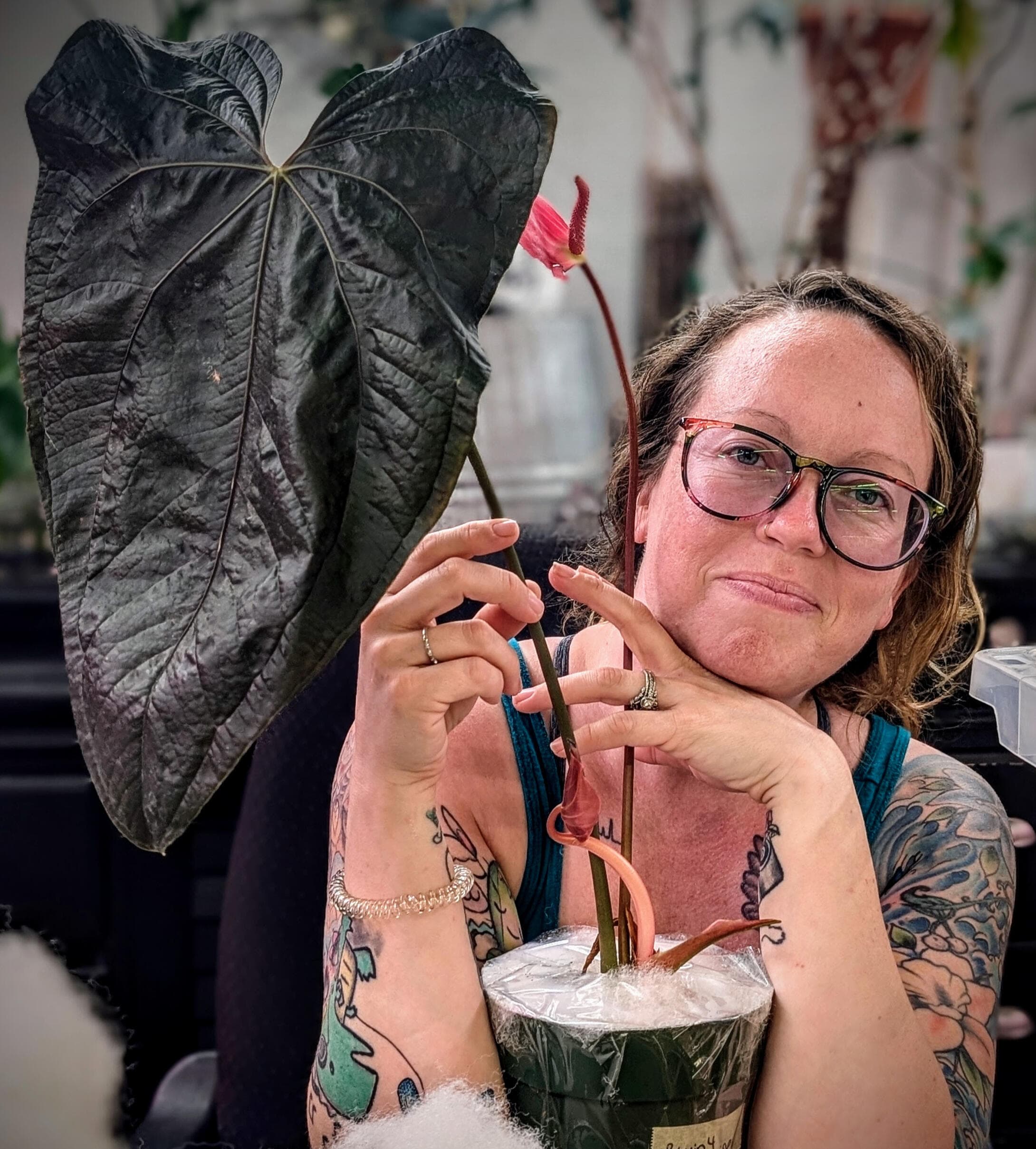 A picture of Natalie with some of her plants.